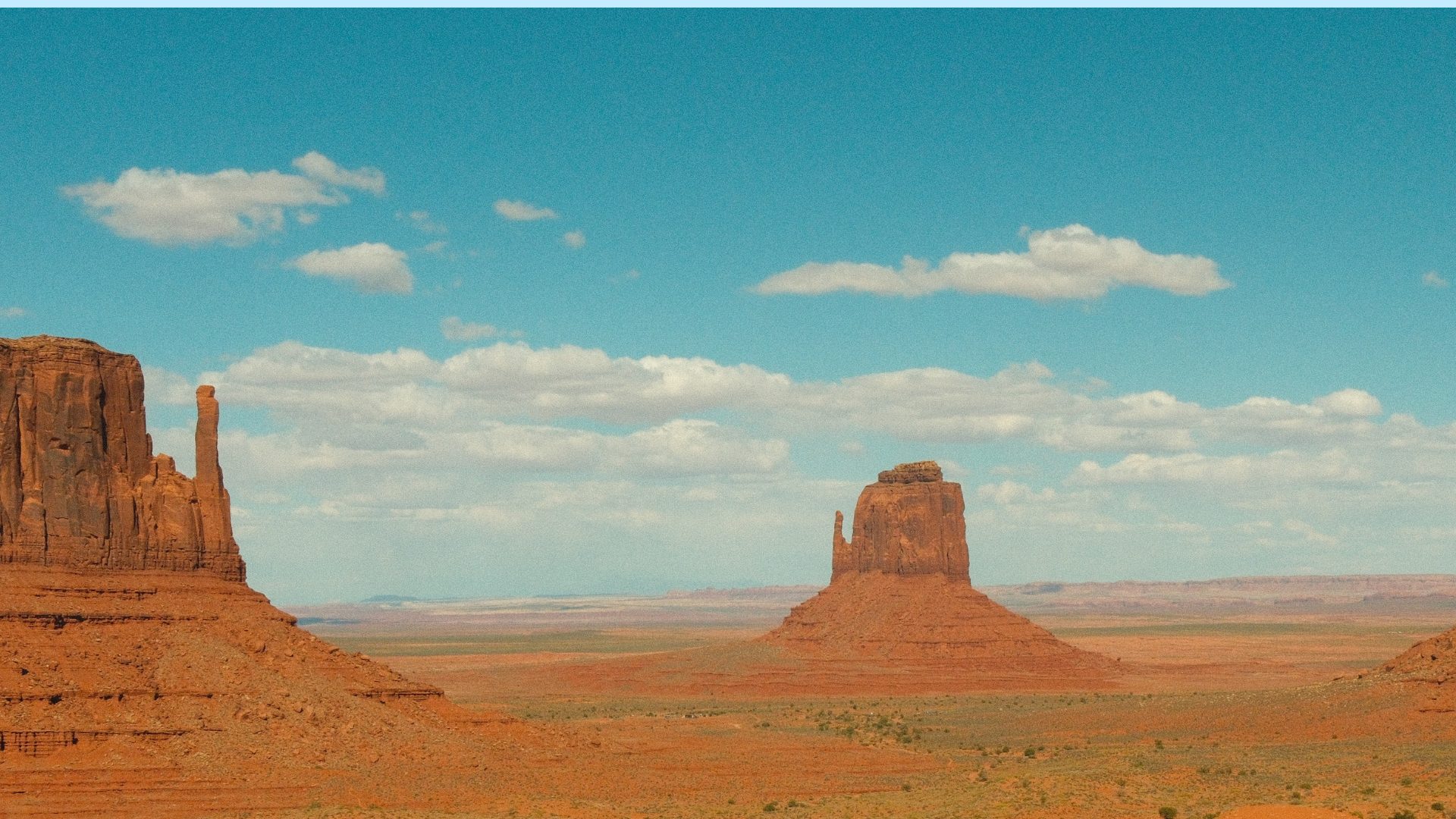 Desert butte formations standing above open terrain