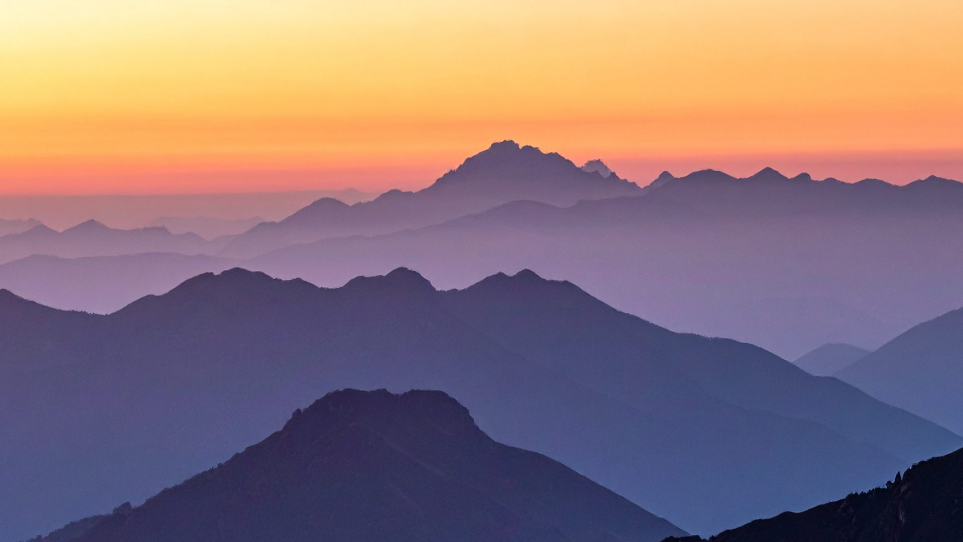 Layered mountain ridgelines at dusk